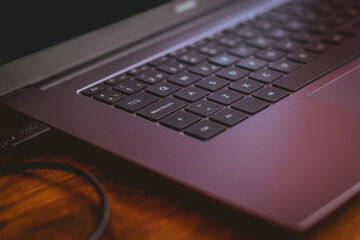 laptop with 2021 design on a wooden table