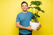 © AntonioDiaz - Portrait of a smiling man taking care of a houseplant