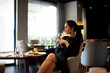 © Connect Images - Young woman staying in boutique hotel enjoying aperitif
