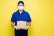 © AntonioDiaz - Cheeful hispanic worker standing in a bright background