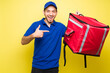 © AntonioDiaz - Man delivery courier smiling and using a backpack