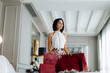 © Connect Images - Fashionable woman with shopping bags in suite