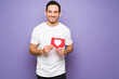 © AntonioDiaz - Hispanic man posting about love in social media