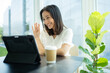 © torwaiphoto - Asian business woman Using the tablet She is having a video conferencing.