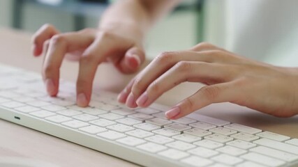 Wall Mural - Close up of hand typing on the computer keyboard, on wooden desk.