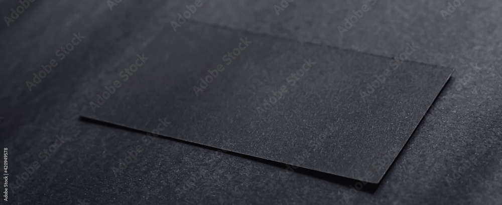 Black business card on dark flatlay background and sunlight shadows, luxury branding flat lay and brand identity design for mockups - obrazy, fototapety, plakaty 