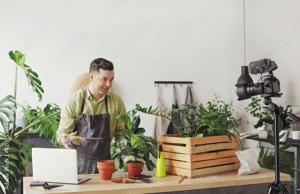 Gardener recording video for his blog at home
