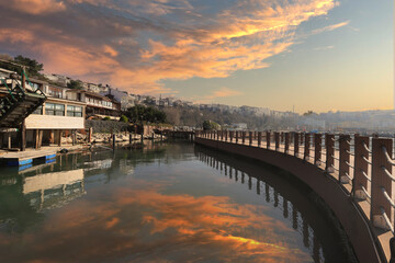 Wall Mural - (Istanbul - Turkey - February 23, 2021) Sile Town, reflections in the sea in a cloudy sky.