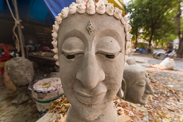 Buddha head made of cement in a Thai temple