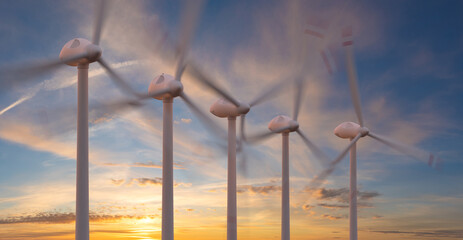 wind turbines against a beautiful evening sky