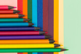 Fototapeta Tęcza - Many multicoloured pencils on colourful background
