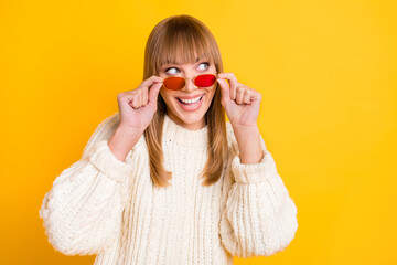 Poster - Photo of nice impressed person hands touch sunglass look empty space isolated on yellow color background