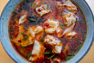 Wall Mural - Chinese delicacy, a bowl of red oil and wonton