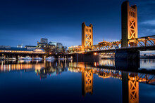 Sacramento Tower Bridge In The Twilight With The Ziggurat Building In The Background, Riverfront Park, West Sacramento. 