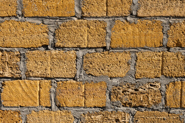 Close-up of a brick shell rock dirty cement bricks. Cement wall