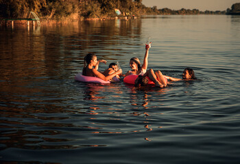 Friends enjoying a summer day swimming at the lake.