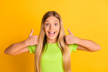 Poster - Photo of young excited girl happy smile show thumb-up like advert fine perfect isolated over yellow color background