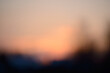 Beautiful soft creamy sunset bokeh background. Defocused sunset or sunrise natural wallpaper. Blurred abstract image of sky and clouds colored with sunlight.