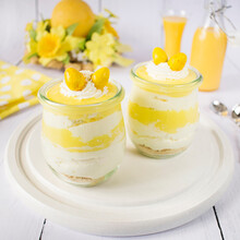 Easter Dessert In Jars With Whipped Cream And Pudding Glaze With The Addition Of Eggnog.