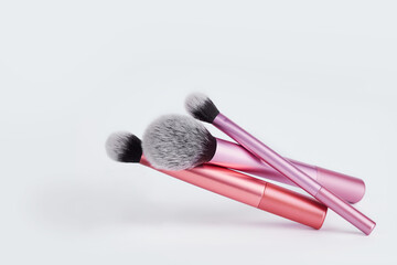 Wall Mural - A bunch of make-up brushes isolated on a white background.