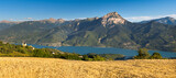 Fototapeta Do pokoju - Serre-Poncon Lake and Grand Morgon Peak in summer with view on Savines-le-Lac village and the chapel of Saint-Apollinaire. Hautes-Alpes, Alps, France