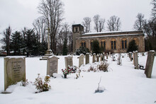 A Church Near Oxford University With Its Grave Stones Covered In Snow.