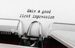 Text Make a good first impression typed on retro typewriter