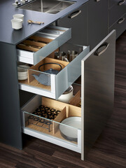 Modern kitchen, Open drawers, Set of cutlery trays in kitchen drawer. Solid oak wood cutlery drawer inserts.