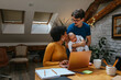 © bernardbodo - Adorable multiracial family of three at home