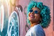 © carballo - portrait of young smiling black afro american woman with blue hair and sunglasses outdoors