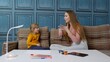 Kid child girl preschooler learn pronunciation with speech therapist teacher or mother at home