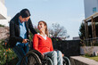© Marcos - mexican latin woman in wheelchair and her friend having fun outdoors in Mexico