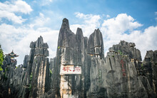 Panoramic View Of Limestone Formation With Shilin In Red Chinese Characters At Shilin Major Stone Forest Park In Yunnan China