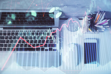 Multi exposure of forex graph drawing over desktop background with computer. Concept of financial analysis. Top view.