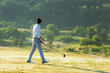 © freebird7977 - Golfer sport course golf ball fairway.  People lifestyle man playing game golf tee off on the green grass.  Asian man player game shot in summer