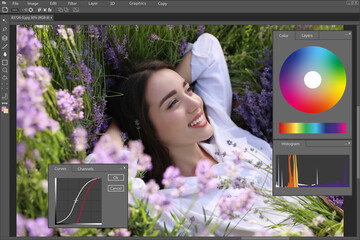 Fototapete - Professional photo editor application. Image of young woman lying in lavender field