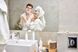 © Roman - pretty woman and handsome guy enjoy morning together, in bathroom