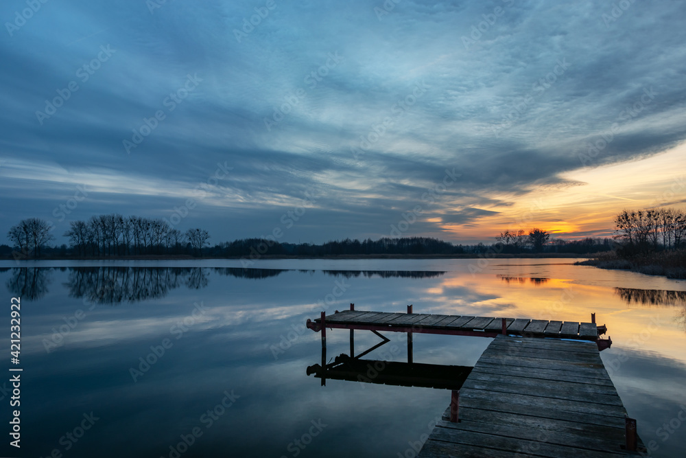 Wooden fishing pier and beautiful evening clouds over the lake, Stankow, Poland - obrazy, fototapety, plakaty 