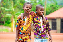 Image Of Two Young African Kids Holding Each Other- Cheerful Black Boys- Outdoor Concept