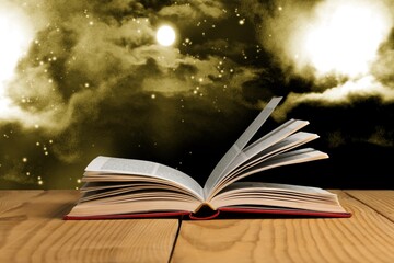 Wall Mural - open book on old wooden table