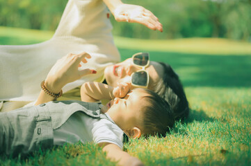 Mother And Baby outdoors. Nature.Portrait of happy loving mother