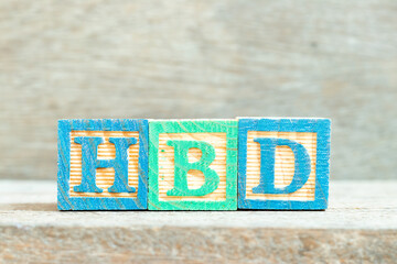 Wall Mural - Color alphabet letter block in word HBD (Abbreviation of happy birthday)  on wood background