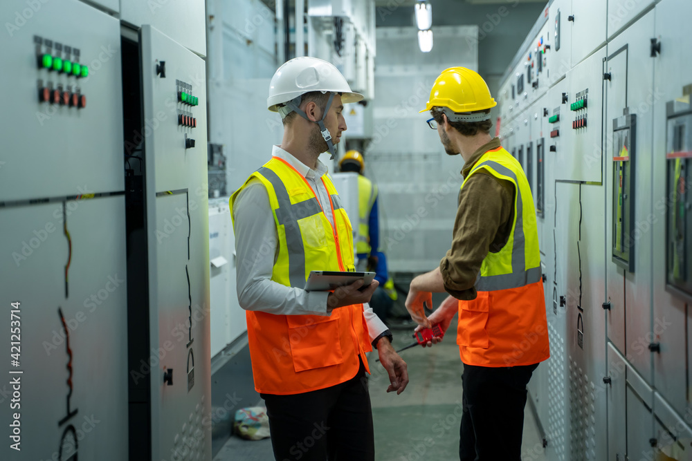 Is Maintenance Engineering Control Maintenance engineers inspect relay protection system in control room ...