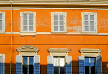 Orange Facade Of The Baroque Building With Blue Windows And Shutters. European Architecture Background