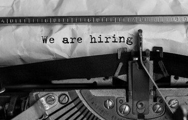 Poster - text we are hiring typed on retro typewriter