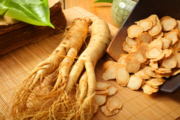 Wall Mural - Fresh ginseng on wooden  background.