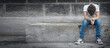 © andranik123 - Caucasian sad boy sitting in the street.