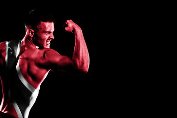 Wall Mural - Trinidad and Tobago flag on handsome young muscular man