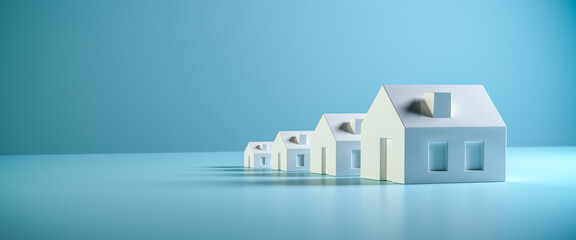 which size of house can you afford? concept shot: four differently sized models of houses on a blue 