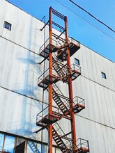 Old Rusty Stair On Industrial Building Facade